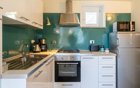 Di Sara: Countertop, Cabinetry, Küche, Zimmer, Möbel, Eigentum, Türkis, Grün, Interior Design, Herd