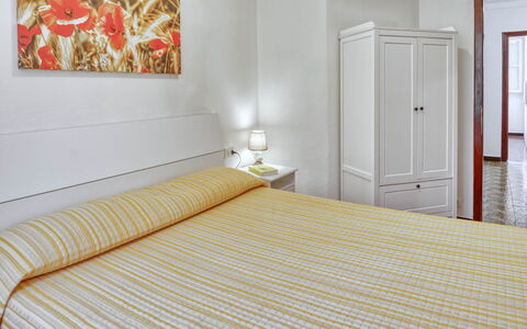 Nina Home - Levanto: Möbel, Eigentum, Komfort, Tür, Gebäude, Holz, Textil, Orange, Schatten, Interior Design