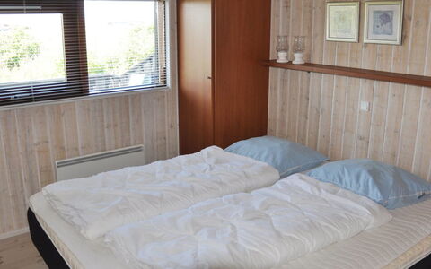 Sigvalda - 250M from the Sea: Bett, Schlafzimmer, Holz, Flooring, Fussboden, Bettdecke, Interior Design, Möbel, Bedding, Bettrahmen