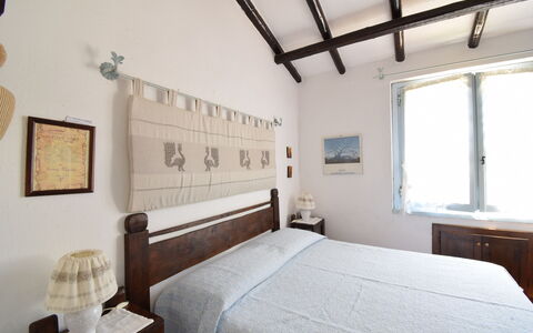 Villetta Oasi Belvedere, Budoni, Wifi, Ac: Möbel, Wand, Schlafzimmer, Holz, Bett, Interior Design, Fussboden, Flooring, Zuhause, Bettdecke