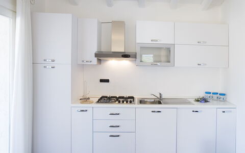 Villa Lentisco: Küche, Major Appliance, Küchengerät, Countertop, Cabinetry, Interior Design, Herd, Haushaltsgerät, Spüle, Flooring