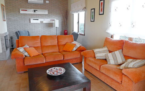 Villa Corona: Wohnzimmer, Möbel, Zimmer, Couch, Orange, Eigentum, Interior Design, Tabelle, Zuhause, Schlafsofa