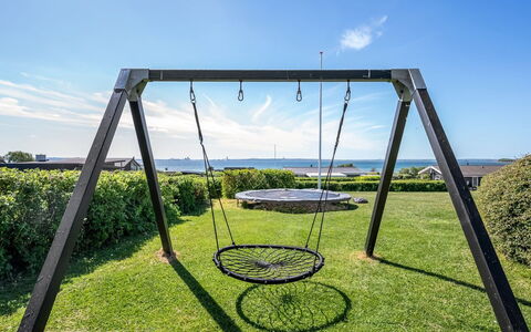 Gertina - 100M from the Sea: Spielmittel, Schwingen, Garten, Rasen, Schatten, Park, Garten, Spielplatz, Trampolin, Landscaping