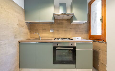 Villa sulla Roccia: Küche, Küchengerät, Major Appliance, Countertop, Cabinetry, Flooring, Holz, Interior Design, Haushaltsgerät, Herd