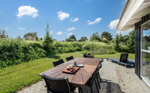 Kristine - 250M from the Sea: Himmel, Grundstueck, Wolke, Möbel, Garten, Schatten, Stuhl, Landscaping, Rasen