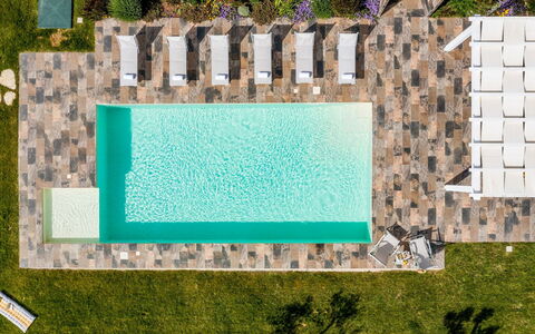 Dama dei Venti 6+2: Schwimmbad, Resort, Gartenmöbel, Flooring, Verbundwerkstoff, Freizeit, Eco Hotel, Thermae, Water Feature, Stuhl