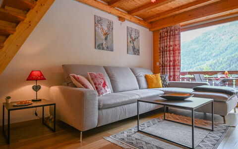 Ovronnaz 700: Möbel, Tabelle, Eigentum, Couch, Bilderrahmen, Fenster, Interior Design, Holz, Beleuchtung, Orange