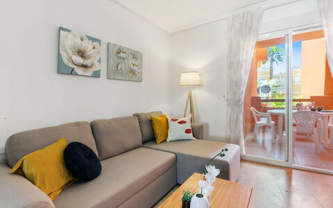 Las Calitas Bloque Iii: Tabelle, Couch, Möbel, Eigentum, Komfort, Bilderrahmen, Wohnzimmer, Interior Design, Orange, Studio Couch